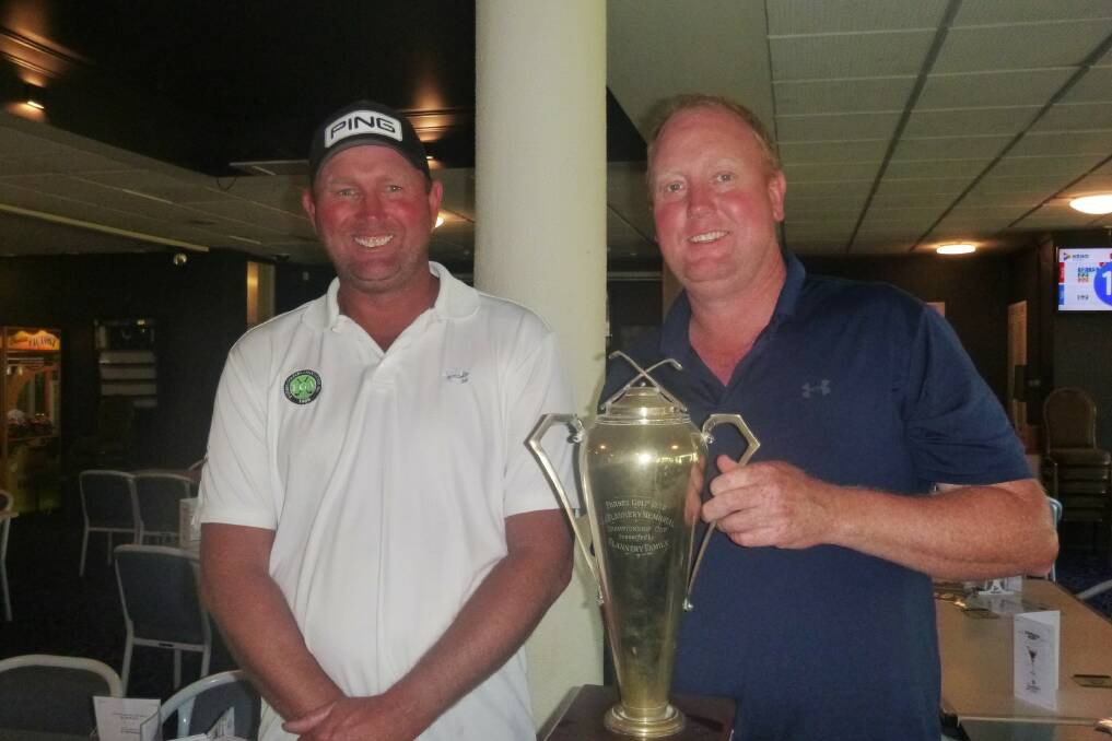 Steve Betland presents the A-Grade Club Champion Trophy to younger brother John. Picture by Short Putt