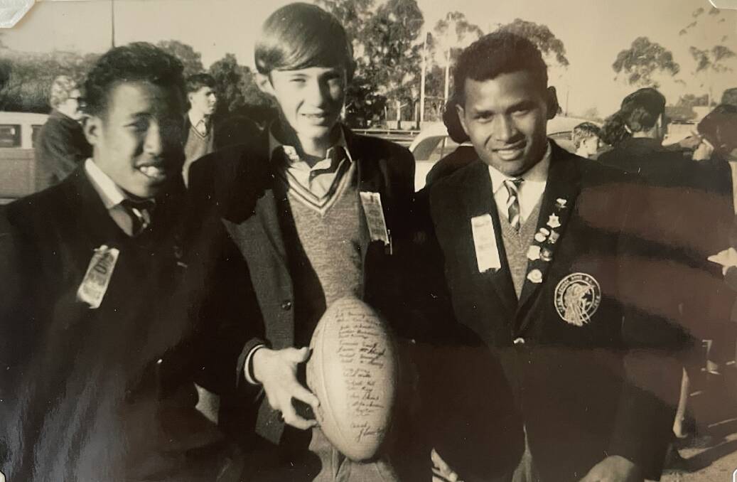 Karo and Edea from the Papua New Guinea 8 stone schoolboys team with John Schrader. Picture supplied 