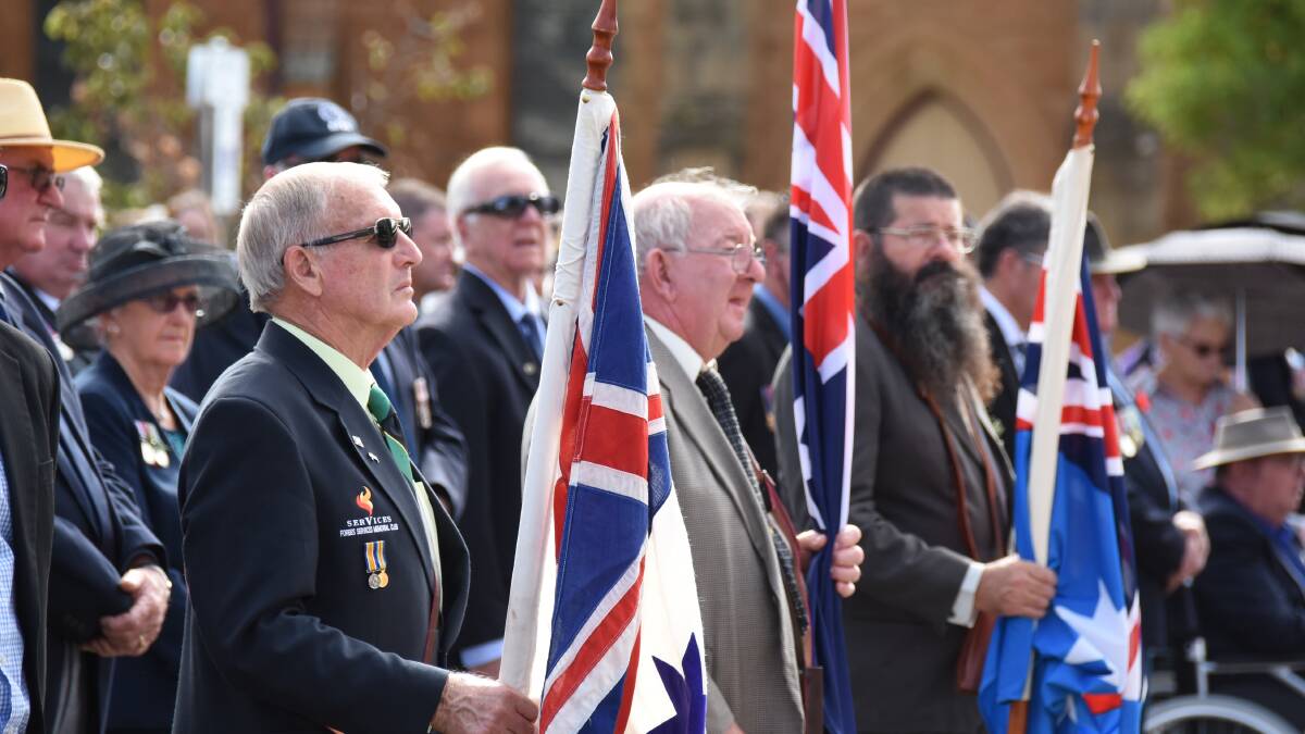 Flag bearers Bryan Jones, Frank Hanns and Andrew Little at 2019 Anzac Day commemorations. File image. 