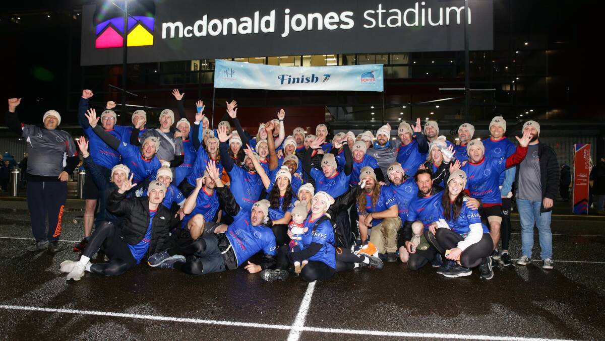 The trekkers in 2022 after completing the walk to McDonald Jones Stadium. Picture by Jonathan Carroll