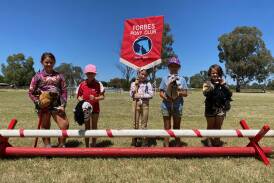 Forbes Pony Club members with cavaletti jump equipment purchased with funding from Forbes Shire Council. Image supplied