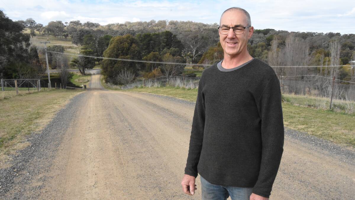 Springbank Lane resident Graham Baker on the stretch of road the 'tight-knit' community have been asking council to seal for 20 years. Picture by Riley Krause